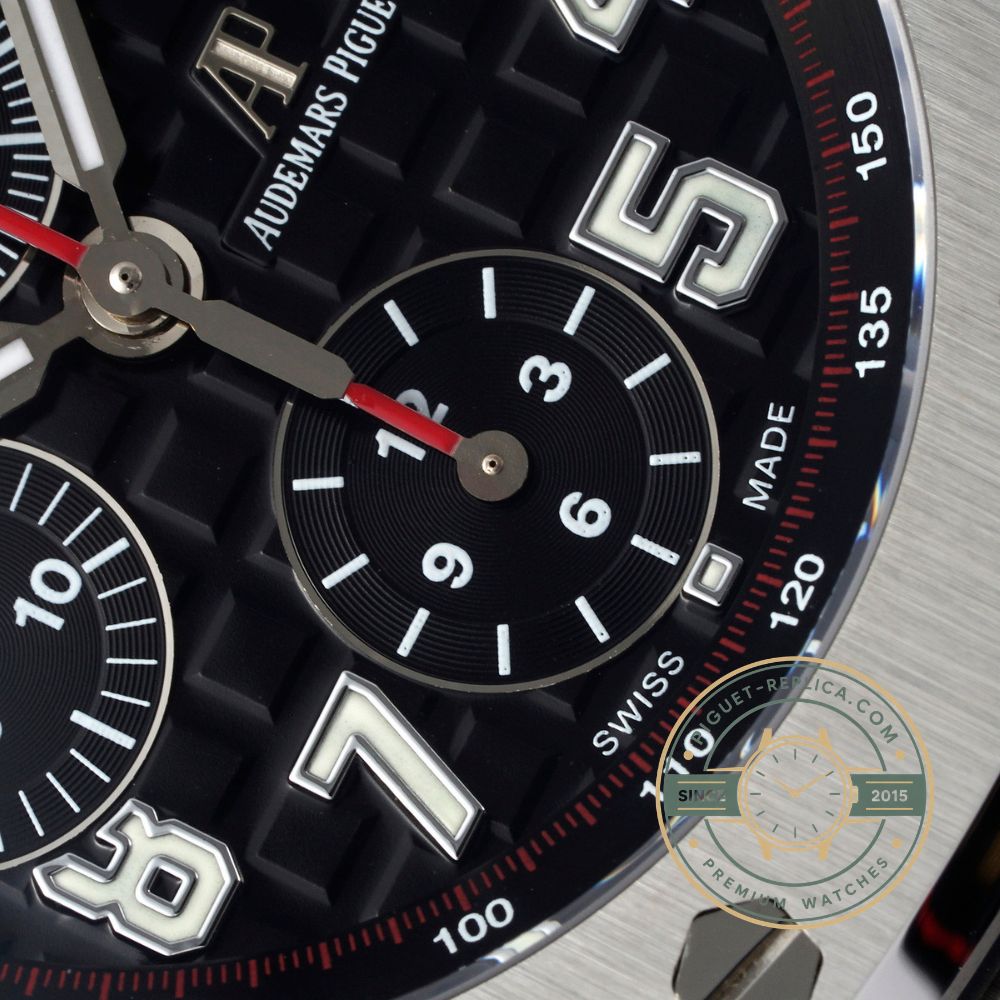 Audemars Piguet replica watch with a dark blue dial, stainless steel bezel and brown crocodile leather strap